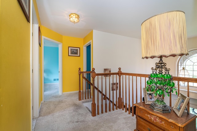5992 Cedar Ridge Dr, Ann Arbor, MI 48103 - corridor with light colored carpet and an upstairs landing