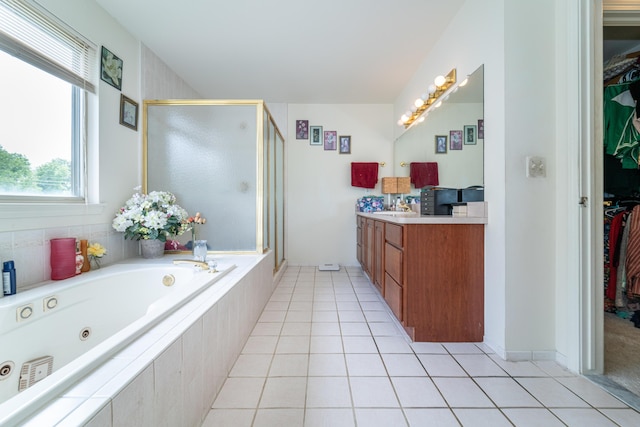 5992 Cedar Ridge Dr, Ann Arbor, MI 48103 - full bathroom with a shower stall, vanity, a walk in closet, and a tub with jets