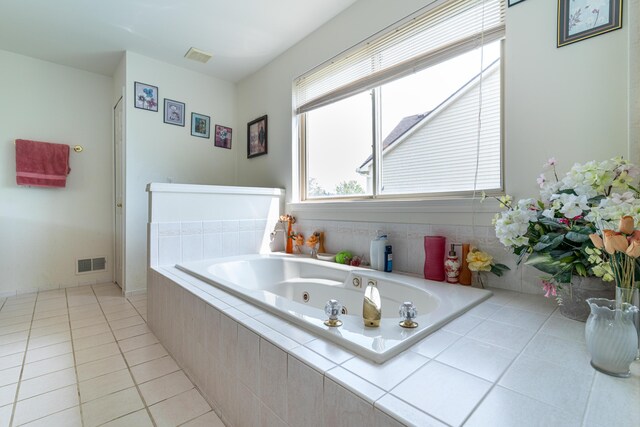 5992 Cedar Ridge Dr, Ann Arbor, MI 48103 - bathroom featuring a tub with jets and tile patterned floors