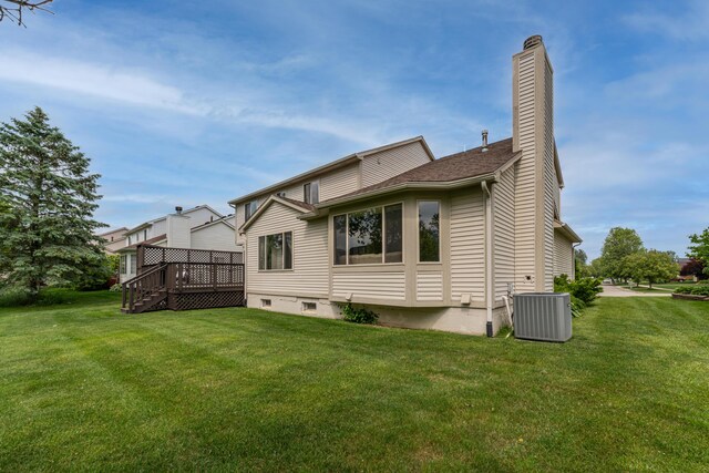 5992 Cedar Ridge Dr, Ann Arbor, MI 48103 - back of property with a deck, a yard, and a chimney