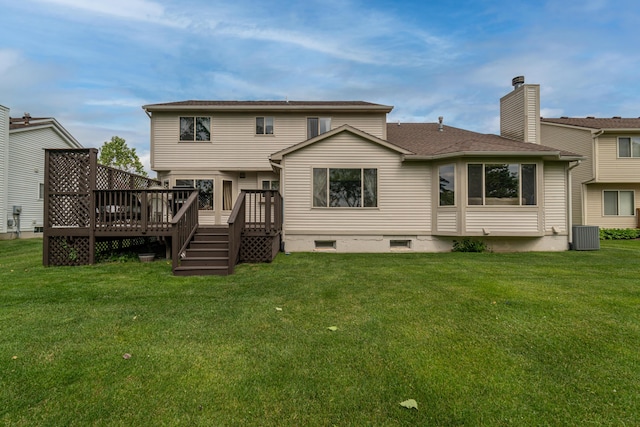 5992 Cedar Ridge Dr, Ann Arbor, MI 48103 - back of property with a deck, a chimney, and a lawn
