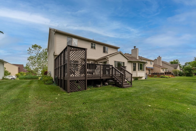 5992 Cedar Ridge Dr, Ann Arbor, MI 48103 - rear view of house with a wooden deck and a yard