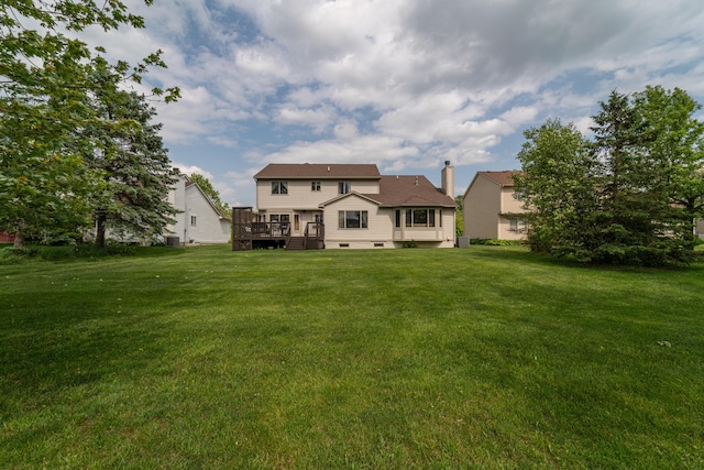 5992 Cedar Ridge Dr, Ann Arbor, MI 48103 - rear view of property with a deck, a yard, and a chimney