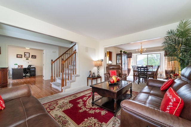 5992 Cedar Ridge Dr, Ann Arbor, MI 48103 - living room with a chandelier, stairs, wood finished floors, and an office area