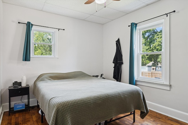 137 W Clark, Jackson, MI 49203 - bedroom with a drop ceiling, multiple windows, wood finished floors, and ceiling fan