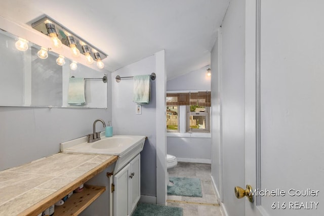 626 Academy St, Portland, MI 48875 - bathroom with vanity and vaulted ceiling