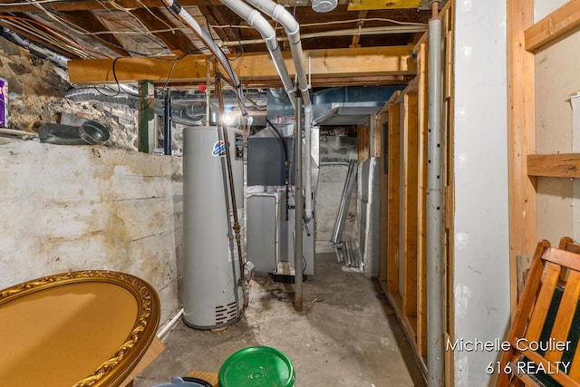 626 Academy St, Portland, MI 48875 - unfinished below grade area featuring gas water heater and heating unit