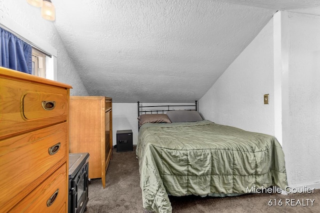 626 Academy St, Portland, MI 48875 - bedroom featuring vaulted ceiling, a textured ceiling, carpet, and a textured wall