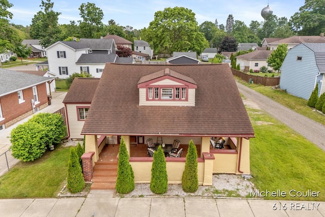 626 Academy St, Portland, MI 48875 - view of front facade featuring covered porch, a residential view, and roof with shingles