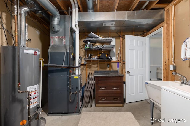 647 Maynard NW, Grand Rapids, MI 49504 - unfinished below grade area with gas water heater, heating unit, and washer / clothes dryer