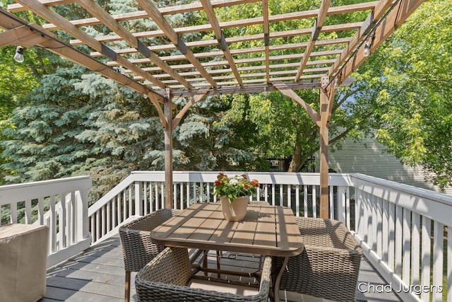 647 Maynard NW, Grand Rapids, MI 49504 - wooden terrace with outdoor dining area and a pergola