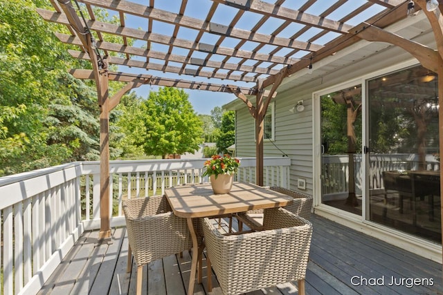 647 Maynard NW, Grand Rapids, MI 49504 - wooden terrace with outdoor dining space and a pergola