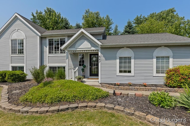 647 Maynard NW, Grand Rapids, MI 49504 - view of front of home with a porch and a shingled roof