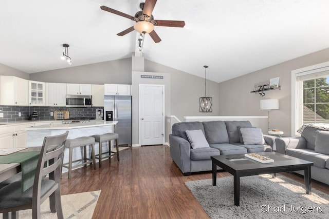 647 Maynard NW, Grand Rapids, MI 49504 - living room featuring dark wood finished floors, a chandelier, and ceiling fan