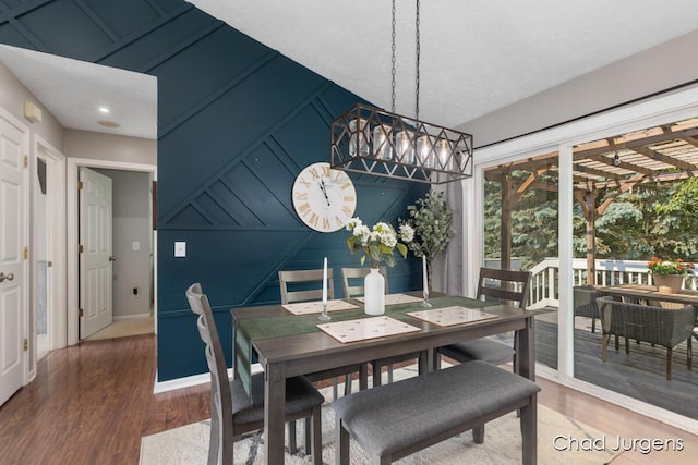 647 Maynard NW, Grand Rapids, MI 49504 - dining room featuring wood finished floors and a decorative wall