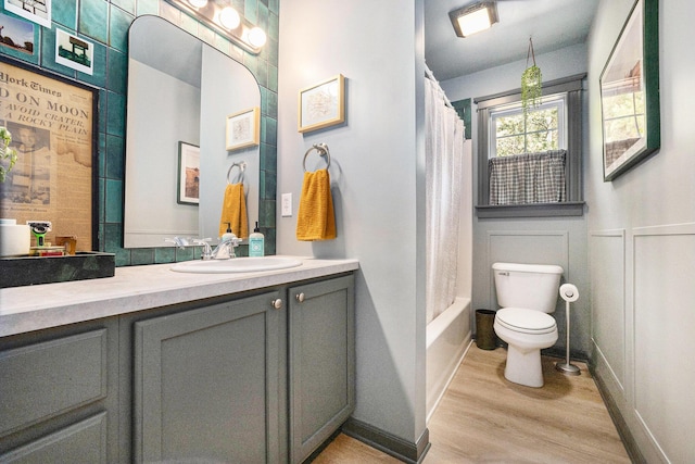 2975 Pine Edge Ct, Holland, MI 49424 - full bath with wood finished floors, vanity, shower / bath combination with curtain, and a decorative wall