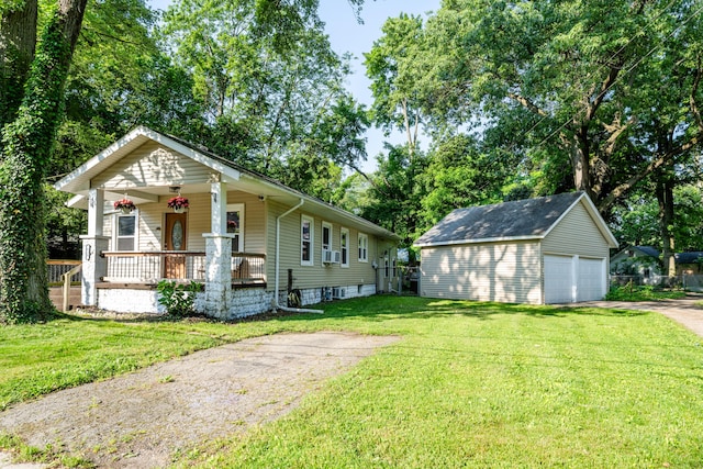 620 Vann St, Niles, MI 49120 - view of front of home featuring a porch, an outbuilding, a front lawn, and a detached garage