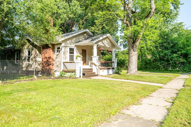 620 Vann St, Niles, MI 49120 - view of front of house featuring a porch and a front lawn