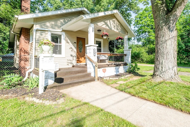 620 Vann St, Niles, MI 49120 - view of front of property featuring a chimney and covered porch