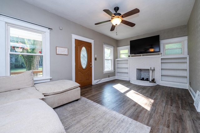 620 Vann St, Niles, MI 49120 - living area with wood finished floors, a fireplace, and a ceiling fan