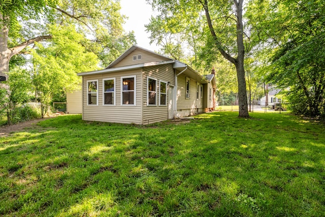 620 Vann St, Niles, MI 49120 - rear view of property with a fenced backyard and a chimney