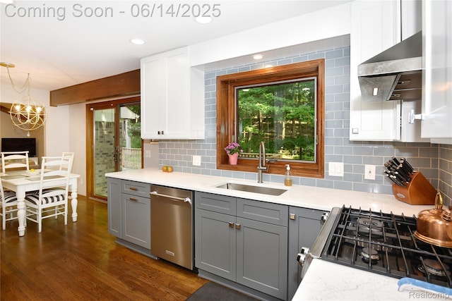 36780 Chesapeake Rd, Farmington Hills, MI 48335 - kitchen featuring stainless steel dishwasher, gray cabinets, under cabinet range hood, and backsplash