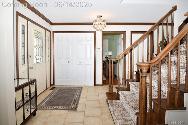 36780 Chesapeake Rd, Farmington Hills, MI 48335 - entrance foyer featuring a chandelier, stairway, ornamental molding, and light tile patterned floors