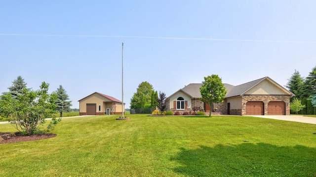 10317 Lange Rd, Birch Run, MI 48415 - ranch-style house with stone siding, a front lawn, concrete driveway, and an attached garage