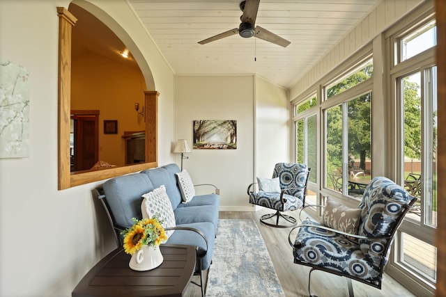 10317 Lange Rd, Birch Run, MI 48415 - sunroom featuring healthy amount of natural light, wood finished floors, arched walkways, and wood ceiling