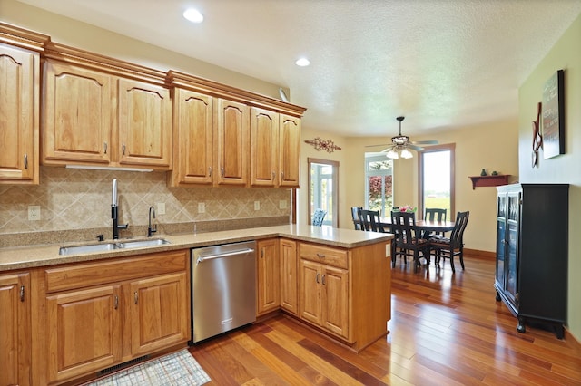 10317 Lange Rd, Birch Run, MI 48415 - kitchen featuring stainless steel dishwasher, a peninsula, decorative backsplash, light wood-style flooring, and recessed lighting