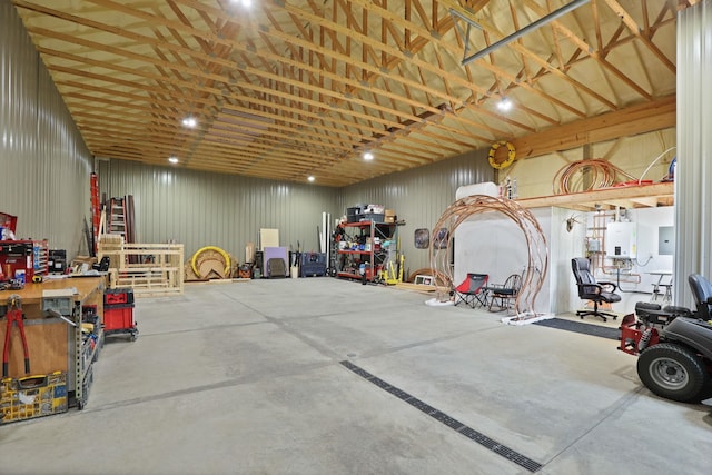 10317 Lange Rd, Birch Run, MI 48415 - garage featuring a workshop area, tankless water heater, and electric panel