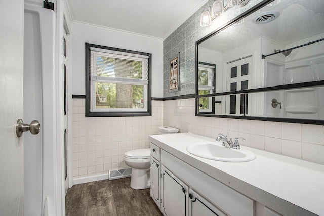 51591 Oak Dr, Mattawan, MI 49071 - bathroom featuring crown molding, tile walls, vanity, wood finished floors, and a shower