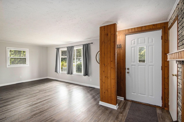 51591 Oak Dr, Mattawan, MI 49071 - foyer entrance featuring a textured ceiling, dark wood-type flooring, and crown molding