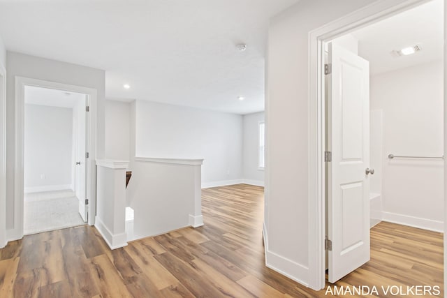 1753 Portadown Rd, Byron Center, MI 49315 - corridor featuring an upstairs landing, wood finished floors, and recessed lighting