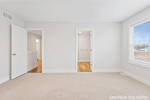 1753 Portadown Rd, Byron Center, MI 49315 - unfurnished bedroom with carpet flooring and baseboards