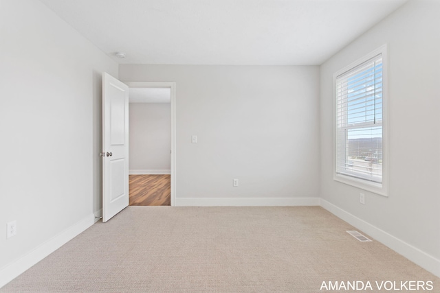 1753 Portadown Rd, Byron Center, MI 49315 - carpeted spare room featuring baseboards and a smoke detector