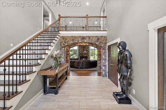 5432 Blood Rd, Metamora, MI 48455 - foyer featuring stairway, a stone fireplace, and wood finished floors