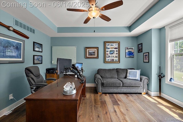 5432 Blood Rd, Metamora, MI 48455 - office area featuring wood finished floors, ceiling fan, and a raised ceiling