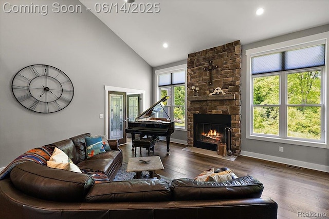 5432 Blood Rd, Metamora, MI 48455 - living area with high vaulted ceiling, a fireplace, wood finished floors, and recessed lighting