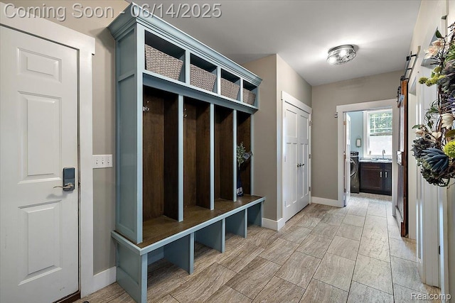 5432 Blood Rd, Metamora, MI 48455 - mudroom featuring washer / clothes dryer and wood finish floors