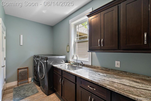 5432 Blood Rd, Metamora, MI 48455 - laundry room with washing machine and clothes dryer, cabinet space, and light wood finished floors