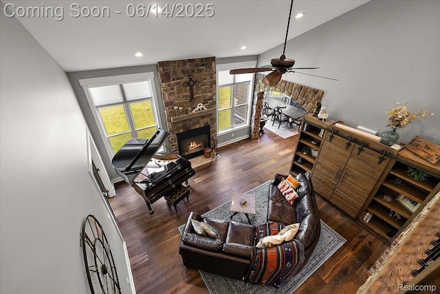 5432 Blood Rd, Metamora, MI 48455 - living room featuring a ceiling fan, wood finished floors, a stone fireplace, and recessed lighting