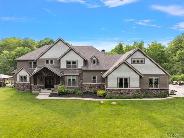5432 Blood Rd, Metamora, MI 48455 - craftsman house featuring stone siding, a front yard, and a chimney