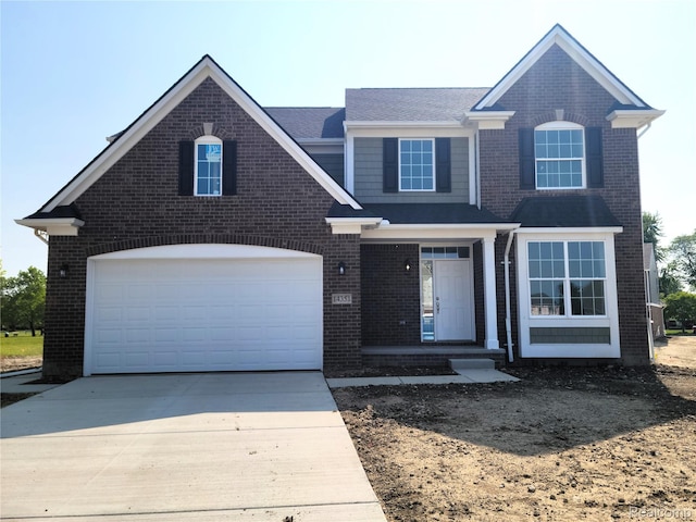 33622 Baldwin St, Farmington Hills, MI 48336 - traditional-style house featuring brick siding, driveway, a garage, and a shingled roof