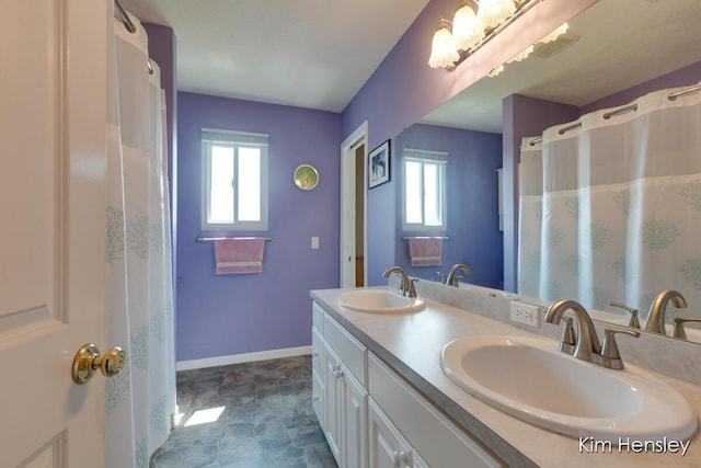 7088 Quintara Dr NE, Comstock Park, MI 49321 - full bathroom with plenty of natural light and double vanity