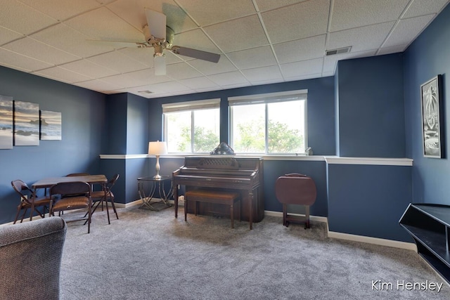 7088 Quintara Dr NE, Comstock Park, MI 49321 - sitting room featuring a drop ceiling, a ceiling fan, and carpet floors