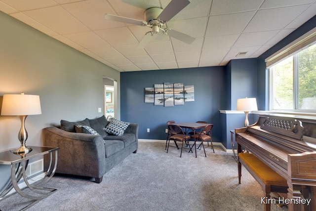 7088 Quintara Dr NE, Comstock Park, MI 49321 - living room featuring carpet flooring, a ceiling fan, a drop ceiling, and arched walkways