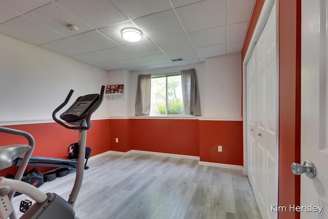 7088 Quintara Dr NE, Comstock Park, MI 49321 - exercise area featuring a drop ceiling and wood finished floors