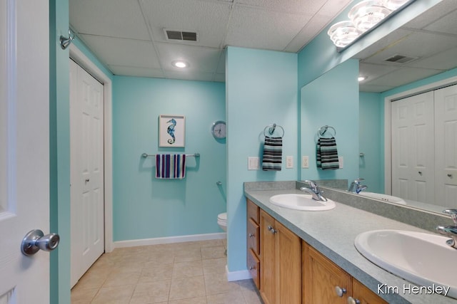 7088 Quintara Dr NE, Comstock Park, MI 49321 - full bathroom with a closet, a drop ceiling, double vanity, and tile patterned floors