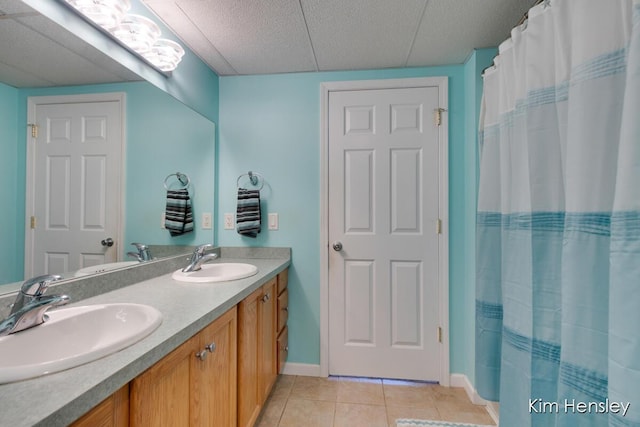 7088 Quintara Dr NE, Comstock Park, MI 49321 - bathroom featuring double vanity, tile patterned floors, and a shower with shower curtain